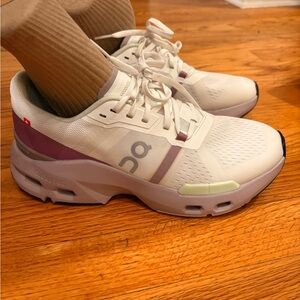 On Running White and Purple Sneakers with Cloud Cushioning